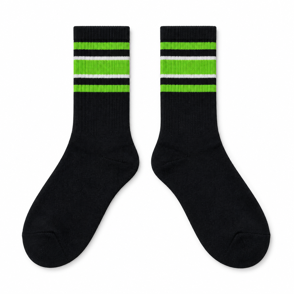 Black socks with lime green and white stripes laid flat on seamless white
