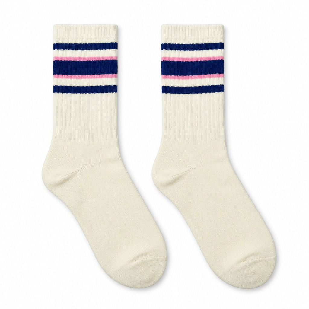 Cream socks with navy and pink stripes laid flat on seamless white