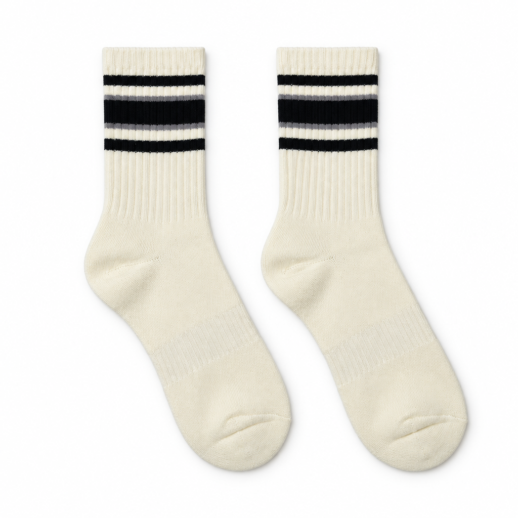Socks laid flat on a seamless white background
